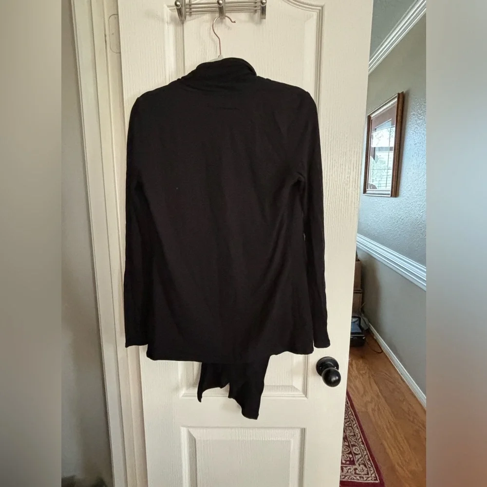 Fabletics wrap type cardigan. Size CS would for sure fit S and probably a medium